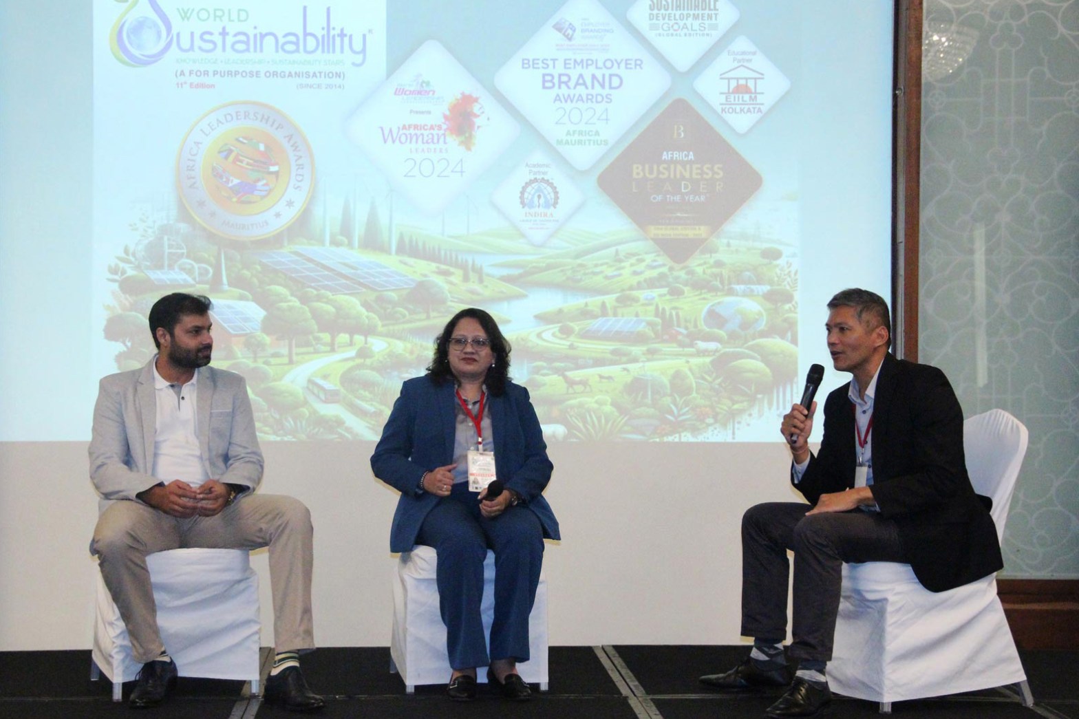 three speakers discussing sustainability at a conference   dr krishna athal