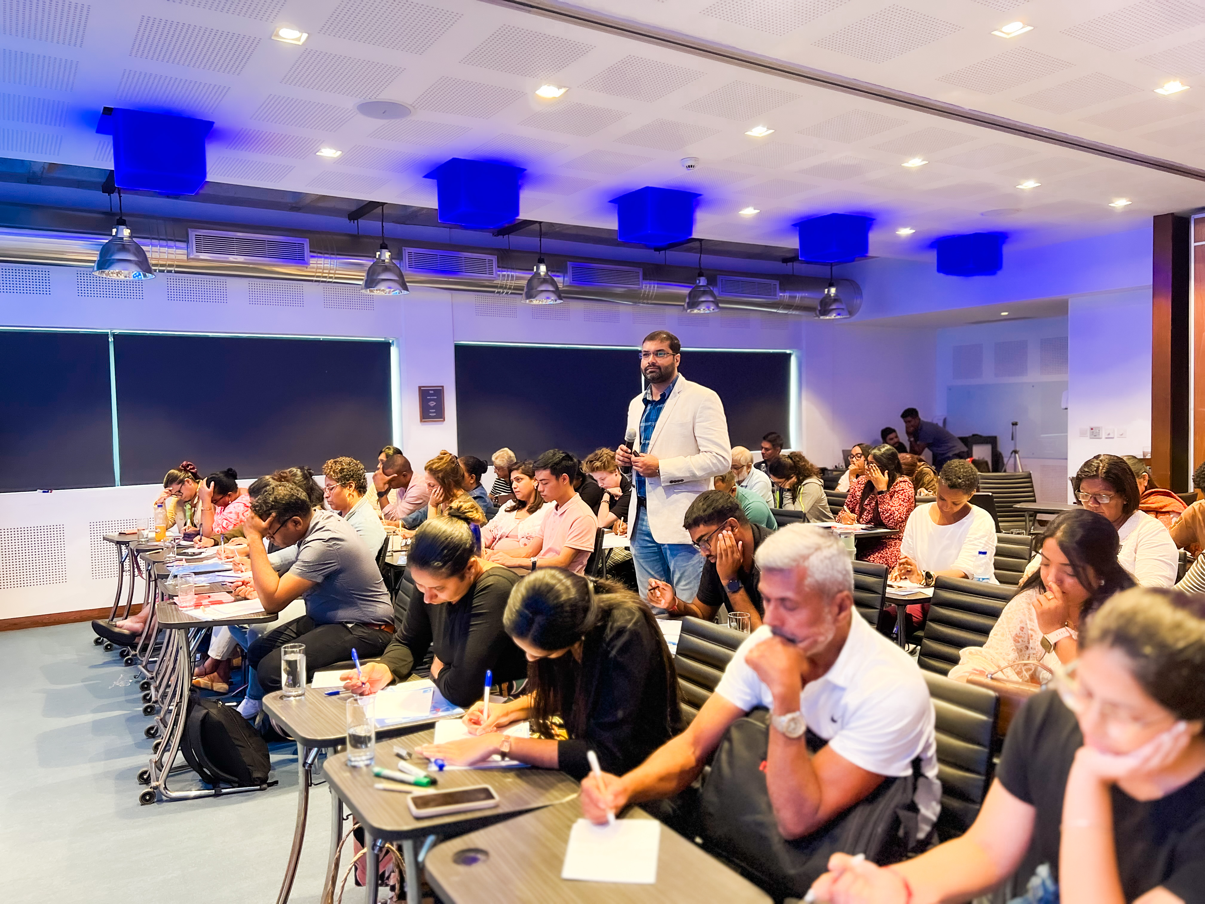 people attending a seminar in a modern conference room   dr krishna athal